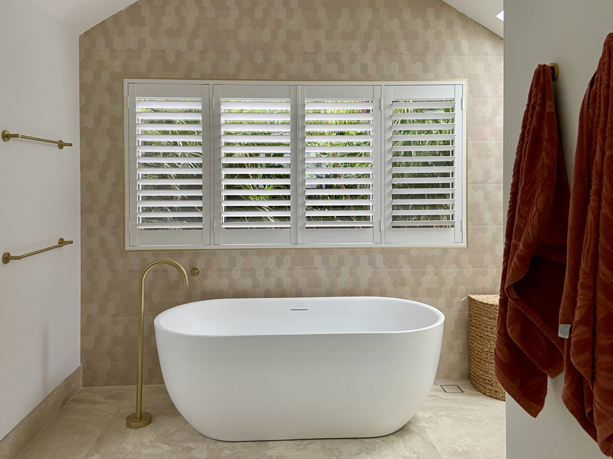 PVC plantation shutters closed for privacy in a Speers Point bathroom